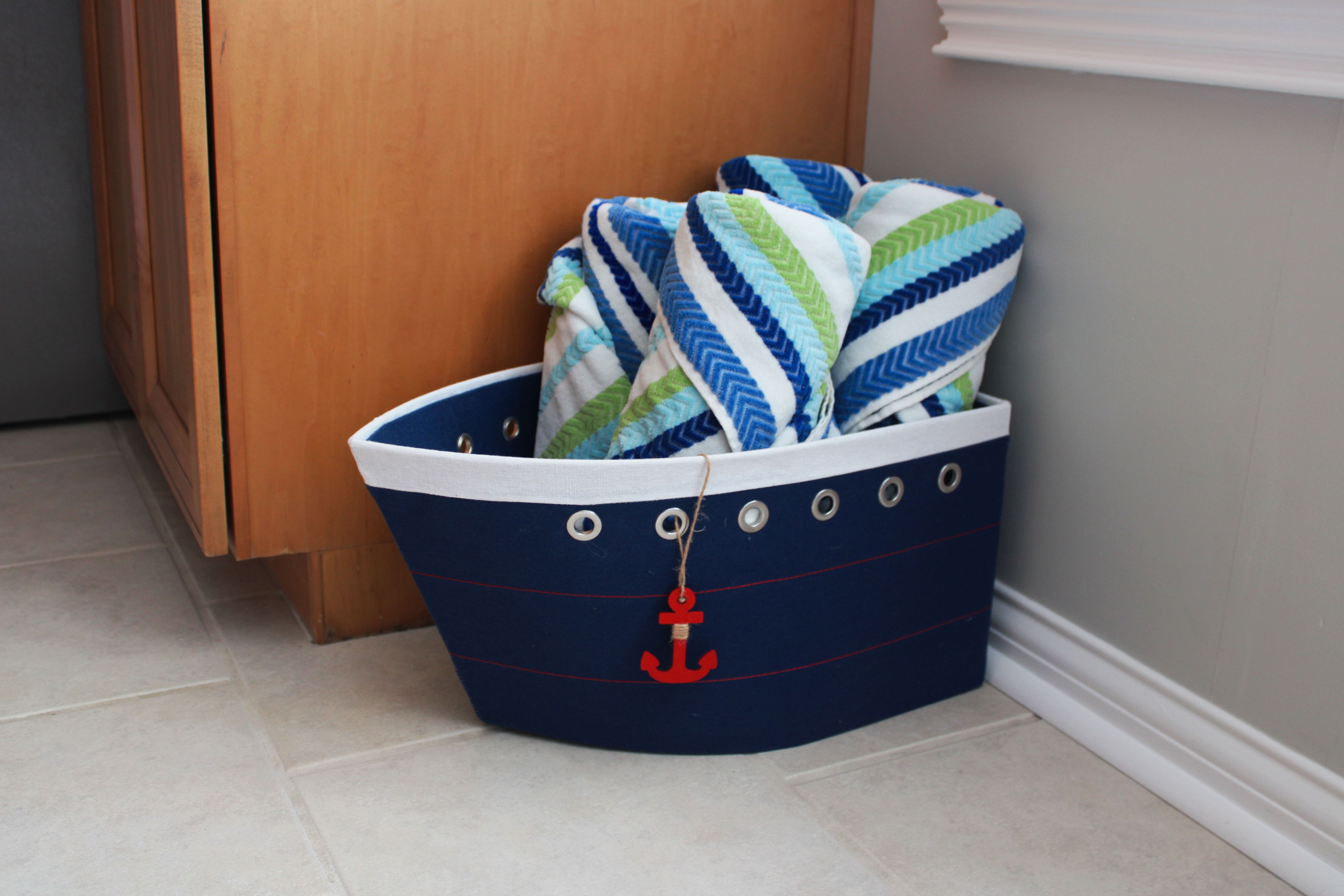 A boat-shaped basket filled with beach towels; just one of the many lake-inspired touches you’ll find throughout the home.
