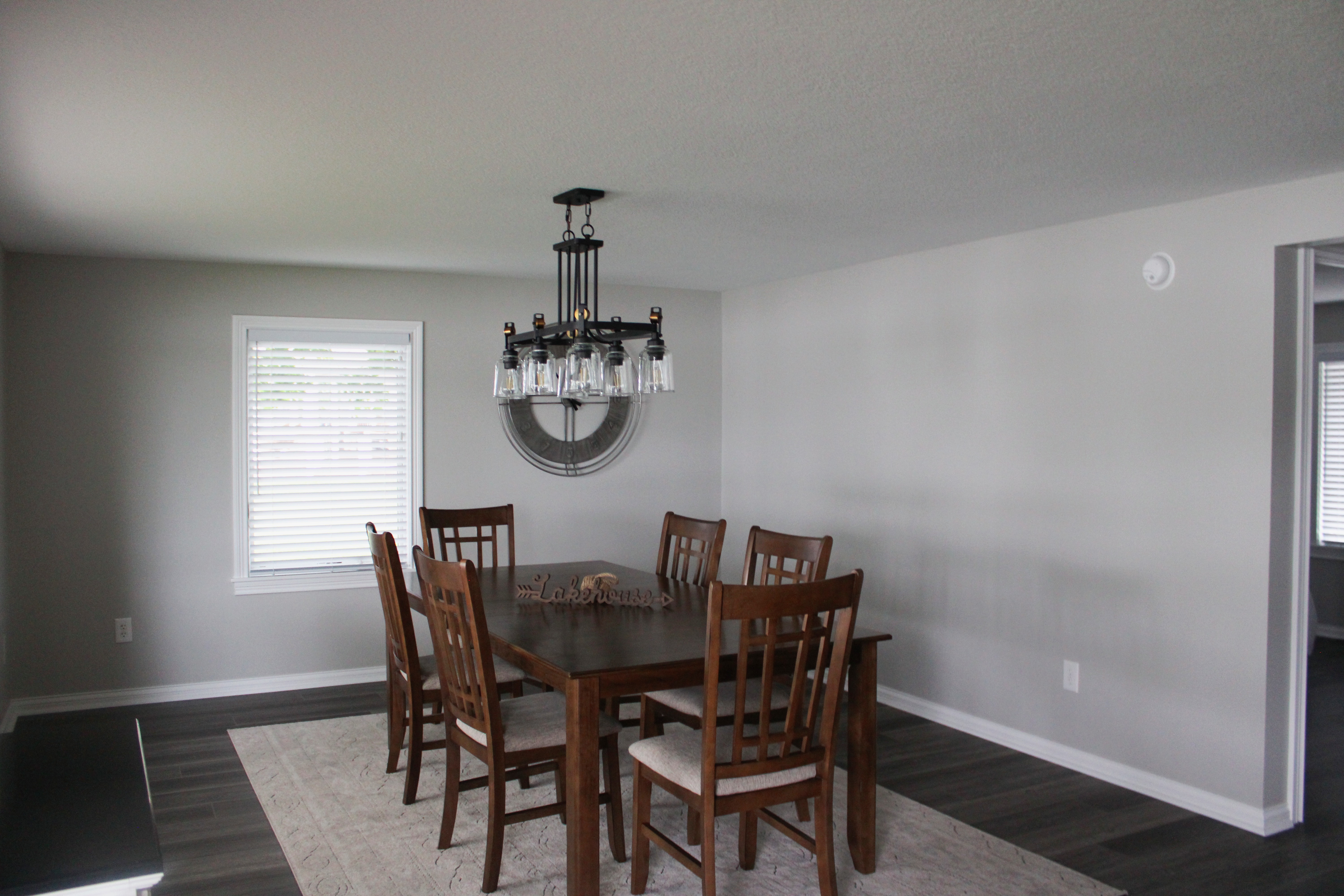 A bright and cozy dining space, surrounded by natural light and perfect for shared meals or game nights.