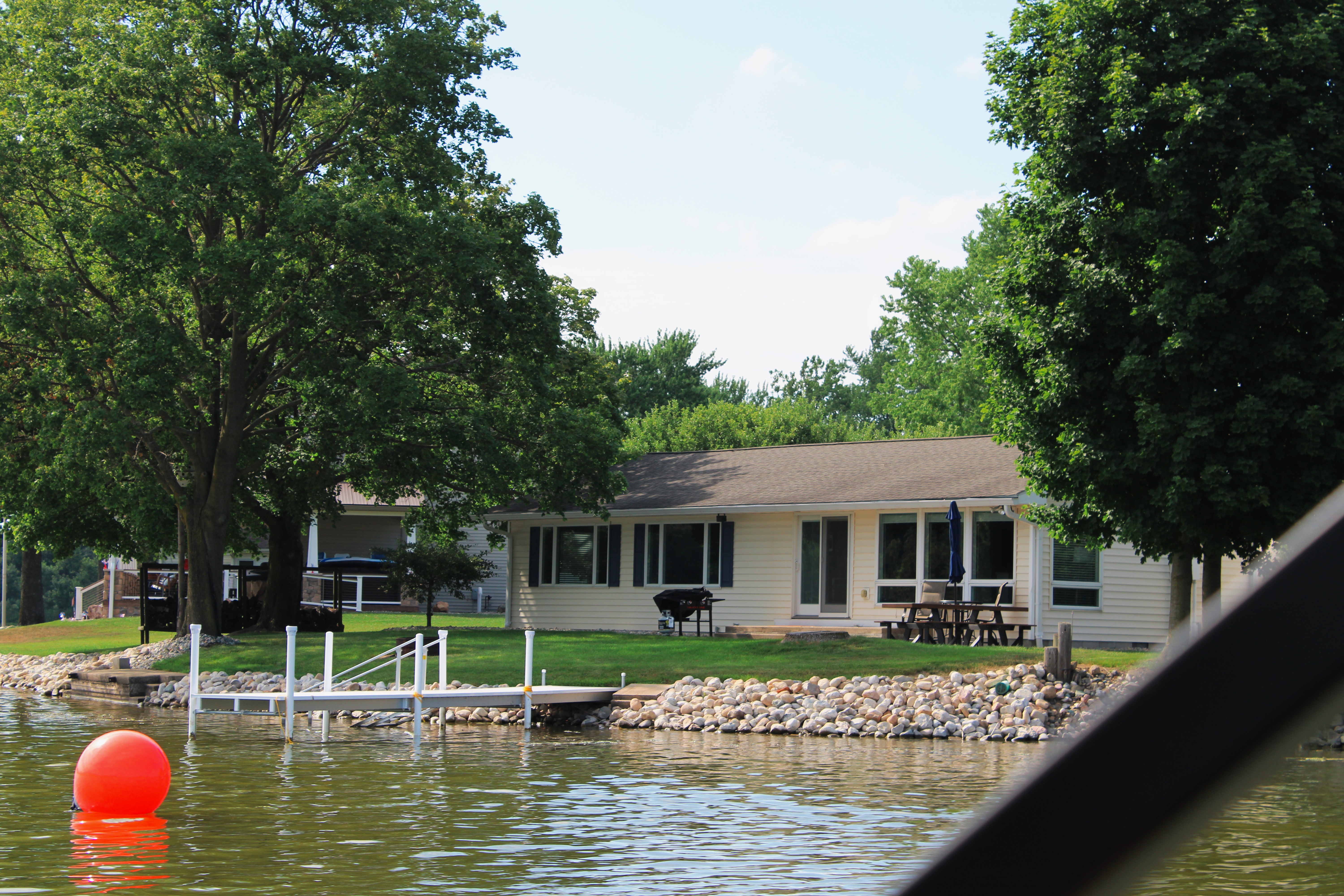 Lakefront rental house with a private pier, offering scenic views and access to the water.