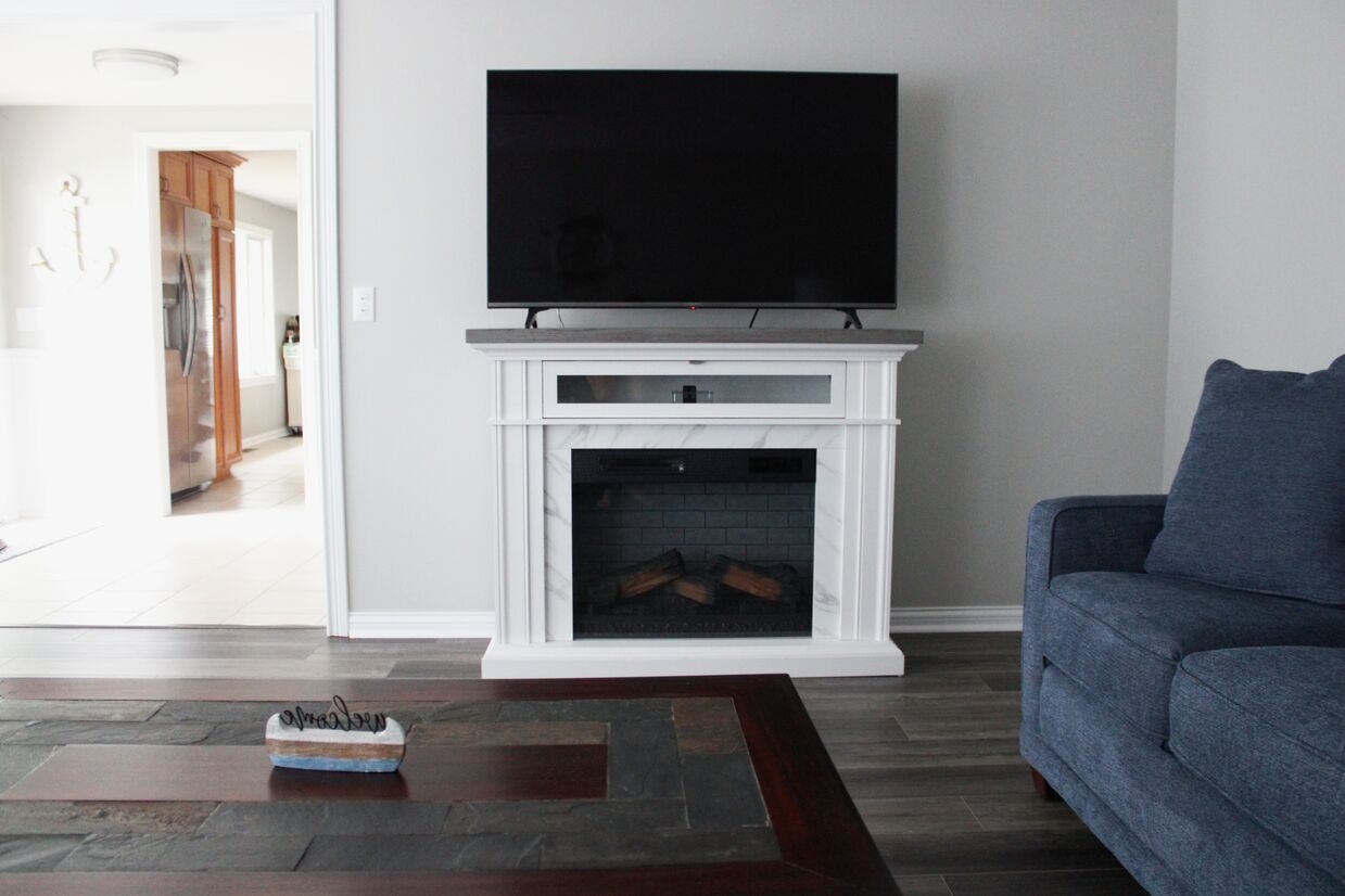 Our lakeside family room features a large smart TV, ideal for movie nights after a day on the water.